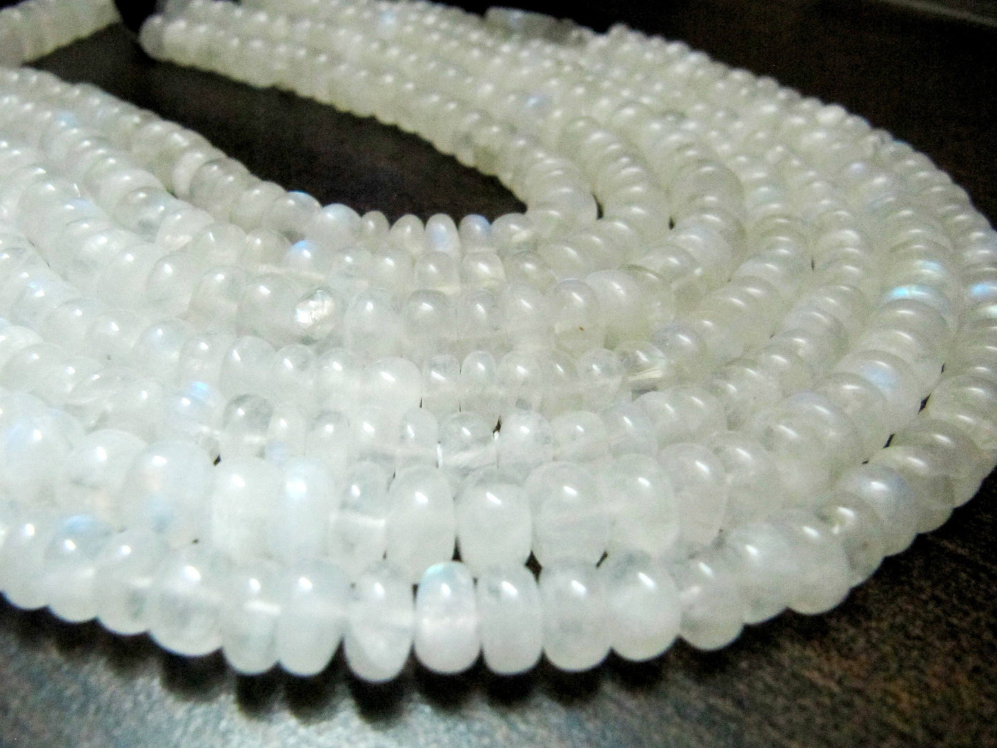 Natural White Rainbow Moonstone Rondelle Plain smooth Beads 7 to 10mm Strand 8 inches long Best Quality Blue Flashy Beads Wholesale Prices