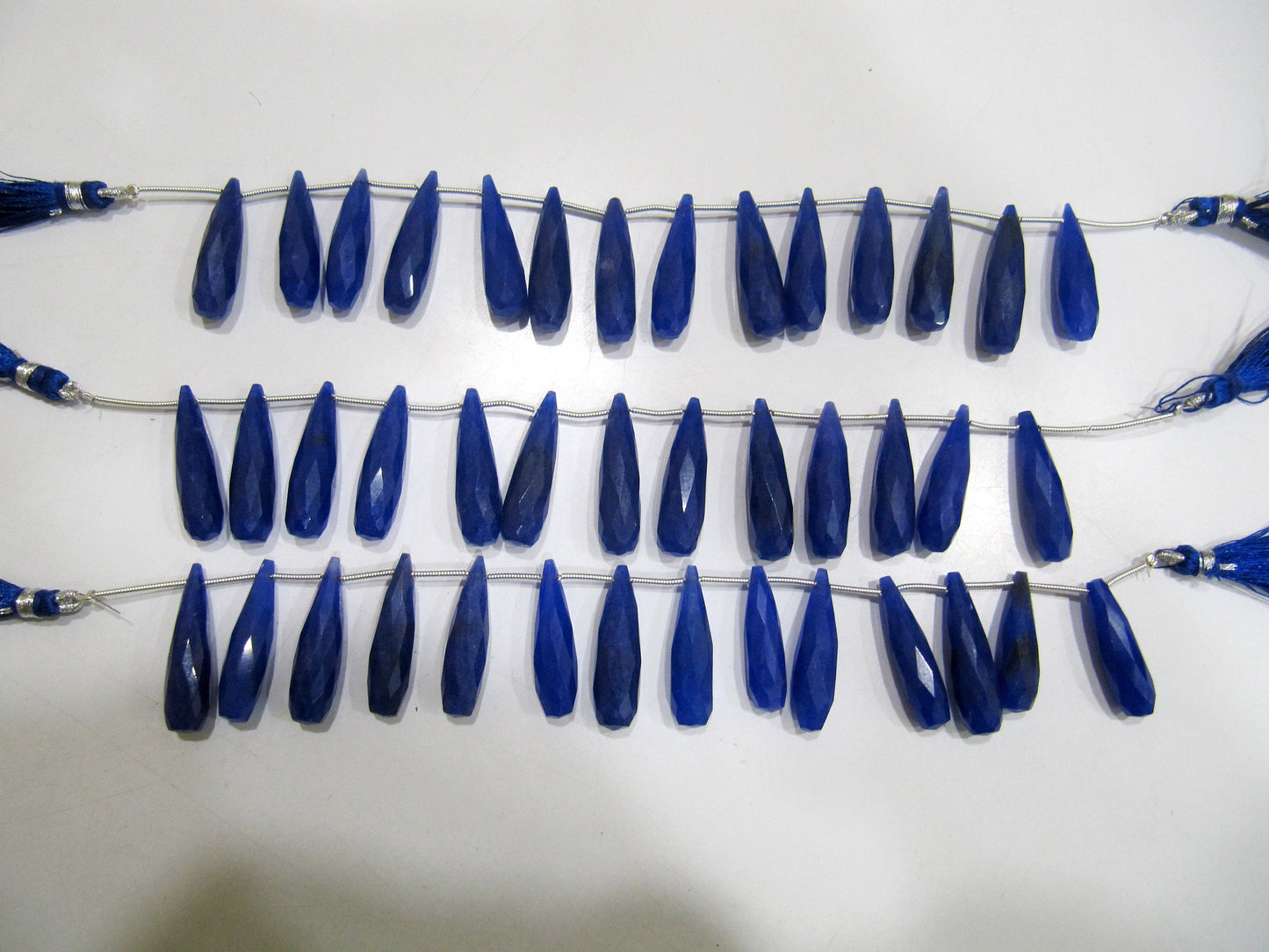 Blue Sapphire Long Tear Drop  Shape Briolette  Faceted Beads  Approx 1 inch Long Sapphire Sold per strand  8 inches long Dyed Beads