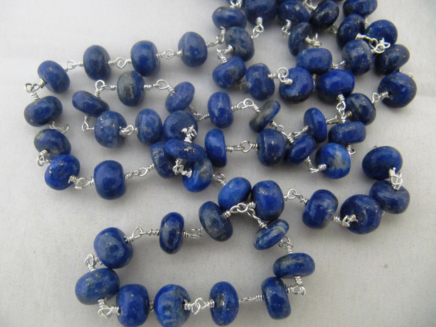 Natural lazuli Lapis Rosary Chain Smooth Beads 6 to 8mm Rondelle Wire Wrap Beaded Chain sold per Foot in Wholesale Rates sold per foot